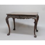 GEORGE II STYLE IRISH MAHOGANY SIDE TABLE, 19th century, the rectangular top above a frieze