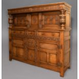 OAK COURT CUPBOARD, the foliate lunette frieze above two doors with arched panels, the base with
