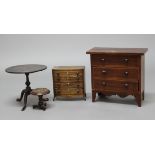 MINIATURE FURNITURE: to include two chests of drawers, a tilt top tripod table and a smaller