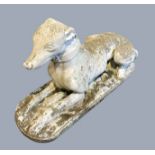 RECONSTITUTED STONE WHIPPET, recumbent on an oval base, length 64cm