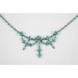 A TURQUOISE AND PEARL SET NECKLACE of foliate swag form, set overall with turquoise cabochons and