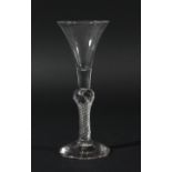 GEORGIAN WINE GLASS, circa 1750, the trumpet bowl on a multiple air twist stem with central knop and