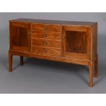 OLIVER MOREL (1916-2003) - COTSWOLD SCHOOL SIDEBOARD, 1970 a mahogany bow front sideboard with ebony