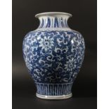 CHINESE BLUE AND WHITE VASE, of baluster form, painted with swirling foliage beneath stiff leaves to