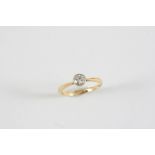 A DIAMOND SOLITAIRE RING the circular-cut diamond is set in 18ct gold. Size K