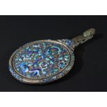 CHINESE WHITE METAL, ENAMELLED AND JADE MOUNTED MIRROR, the circular plate on a back with exotic