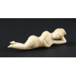 JAPANESE IVORY OKIMONO, circa 1900, of a naked female figure, used as a medical aid, length 15cm