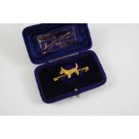 A 15CT GOLD TERRIER BROOCH realistically formed, 4cm long. With box