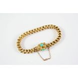 A GOLD AND TURQUOISE FANCY LINK BRACELET the clasp mounted with three oval turquoise cabochons, 16cm