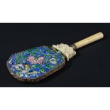 CHINESE ENAMELLED AND IVORY MOUNTED MIRROR, the back with an exotic birds above flowering foliage,