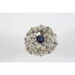 A SAPPHIRE AND DIAMOND COCKTAIL RING the circular-cut sapphire is set within an 18ct white gold