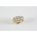 A DIAMOND TWO ROW RING millegrain set with ten old brilliant-cut diamonds, in 18ct gold and