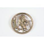 A SILVER CIRCULAR BROOCH BY GEORG JENSEN depicting a deer amongst foliage, with maker's mark and