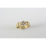 A DIAMOND SOLITAIRE RING the circular-cut diamond is collet set in 18ct gold. Size N