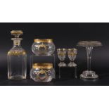 COLLECTION OF GILT DECORATED GLASS, to include a set of four square section decanters and ten shot