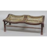 THEBES STYLE DOUBLE FOOTSTOOL possibly retailed by Liberty & Co, the low stool with ring turned legs