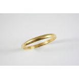 AN 18CT GOLD HALF HINGED BANGLE 17.7 grams, internal measurements 6.5cm dia