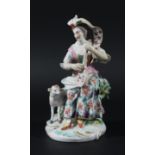 DERBY PATCH MARK FIGURE OF A SHEPHERDESS, seated playing a mandolin, a sheep to her side, height