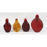 FOUR CHINESE SNUFF BOTTLES, including one possibly copal amber and three probably amber style (4)
