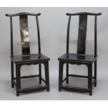 PAIR OF CHINESE BLACK LACQUERED YOKE BACK CHAIRS, the splat with a chilong roundel, height 113cm (