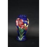 MOORCROFT VASE - FREESIA the vase painted in the Freesia design on a blue ground. Marked, Potters to