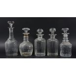 COLLECTION OF TEN MALLET FORM DECANTERS AND STOPPERS, mainly 19th century, with various