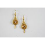A PAIR OF GOLD AND PEARL DROP EARRINGS each earring with rope and foliate decoration, centred with a