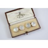 A PAIR OF MOTHER OF PEARL, ENAMEL AND GOLD CUFFLINKS each mother of pearl link is centred with a