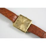 A GENTLEMAN'S GOLD PLATED WRISTWATCH BY LONGINES the signed square-shaped gold coloured dial with