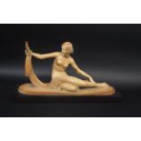 ART DECO FRENCH FIGURE OF A LADY a plaster figure of a nude lady, holding a mirror in one hand. With