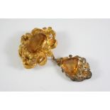 A VICTORIAN CITRINE AND GOLD BROOCH the large oval-shaped citrine is mounted in an ornate foliate