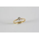 A DIAMOND SOLITAIRE RING the old circular-cut diamond is set in 18ct gold and platinum. Size P 1/2