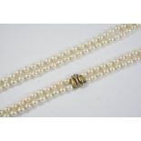 A DOUBLE ROW UNIFORM CULTURED PEARL NECKLACE the pearls measure approximately 6.5mm and are set to a