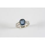 A SAPPHIRE AND DIAMOND RING the oval-shaped sapphire weighs approximately 2.16 carats and is set