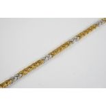 A DIAMOND AND GOLD BRACELET BY MEISTER the 18ct two colour gold bracelet of plaited design is