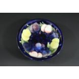 MOORCROFT BOWL - PLUM a shallow bowl in the Wisteria Plum design. Marked, W Moorcroft, Potter to