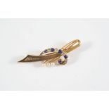 A SAPPHIRE, DIAMOND AND CULTURED PEARL BROOCH of abstract design, with scrolled centre pave set with