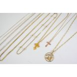 A 9CT GOLD CRUCIFORM PENDANT AND CHAIN together with another 9ct gold cruciform pendant and chain, a