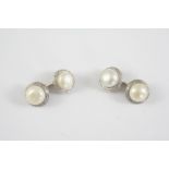 A PAIR OF CULTURED PEARL AND PLATINUM CUFFLINKS BY BOUCHERON each cultured pearl link in a foliate