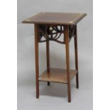 ART NOUVEAU OCCASIONAL TABLE a 2 tier mahogany table with inlaid heart shaped motifs, with a pierced