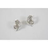 A PAIR OF DIAMOND EARRINGS of scrolling form, each set with circular-cut diamonds in white gold, 2.