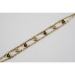 A GOLD, SAPPHIRE AND DIAMOND BRACELET BY REPOSSI the 18ct gold double row chain bracelet is