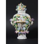BOW FRILL POT POURRI VASE AND COVER, circa 1765, of ovoid form, applied with masks and flowers and