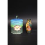 DENNIS CHINA WORKS - KINGFISHER a lidded jar painted with Waterlillies and with a Kingfisher finial,