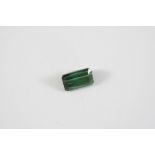A LOOSE SINGLE TOURMALINE STONE the rectangular-shaped green tourmaline weighs approximately 9.50