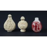 CHINESE GLASS SNUFF BOTTLE, red through to a frosted white ground, height 6cm; together with two