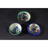 MOORCROFT QUAICH an unusual two handled bowl in the Spring Flowers design, with a green and blue