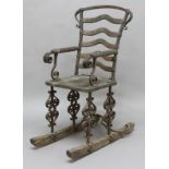 ARTS & CRAFTS IRON & WOODEN ROCKING CHAIR an interesting 19thc chair with a wooden seat and rockers,