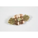 A TWO COLOUR GOLD DOUBLE CLIP BROOCH of geometric shape, the brooch divides to form two clips, 5.5cm