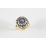 A VICTORIAN SAPPHIRE AND DIAMOND CLUSTER RING the circular-cut sapphire weighs approximately 2.10